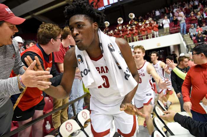 Alabama center Charles Bediako (10) gives high fives to fans in the student section Saturday, Feb. 26, 2022, at Coleman Coliseum in Tuscaloosa, Alabama. The Crimson Tide defeated the Gamecocks 90-71.